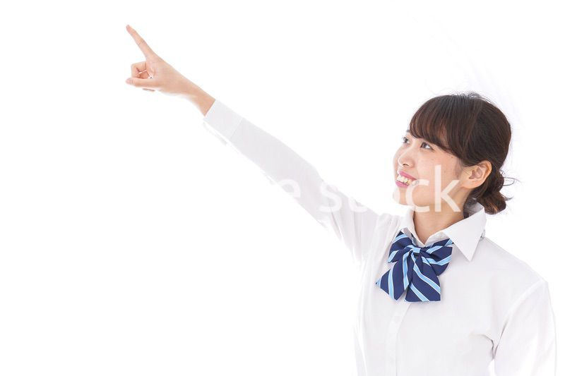 未来を指差す若い学生