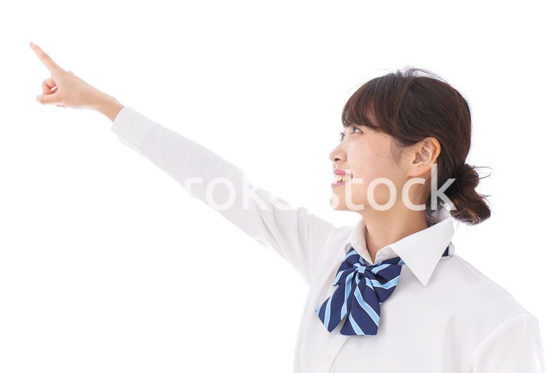 未来を指差す若い学生