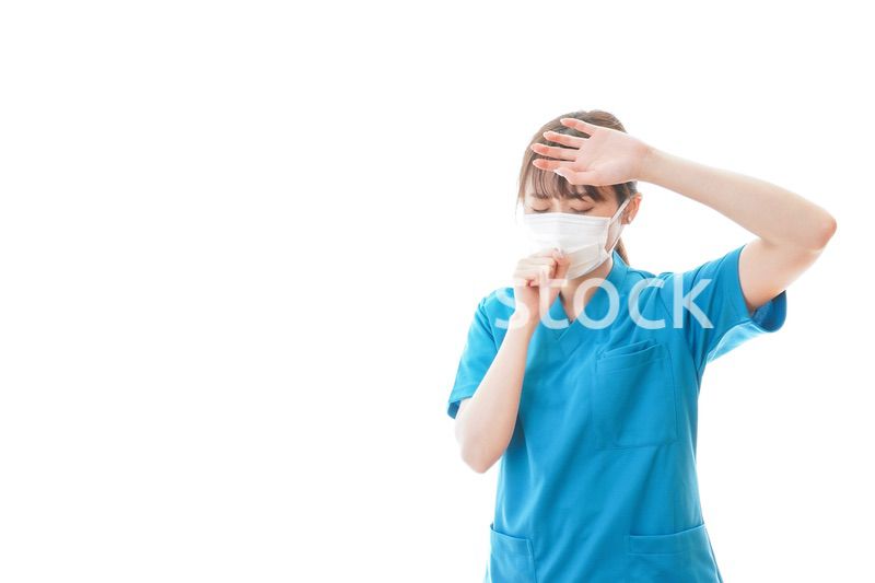 感染症にかかり体調不良に苦しむ医療従事者