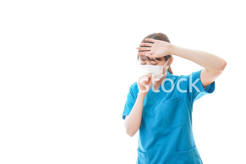 感染症にかかり体調不良に苦しむ医療従事者