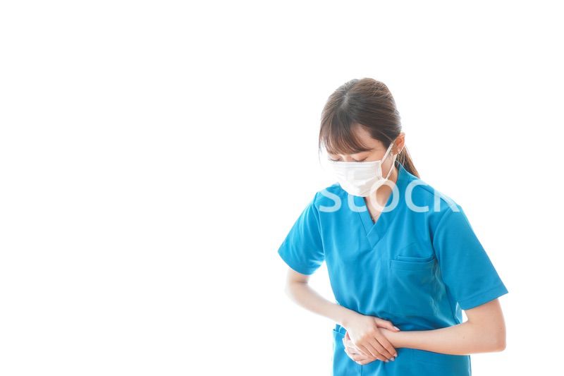 感染症にかかり体調不良に苦しむ医療従事者