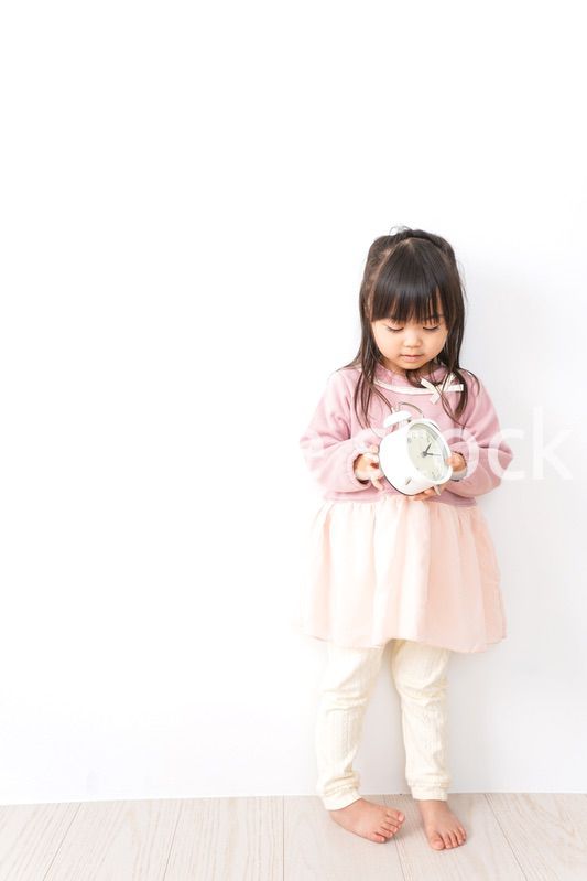 時計を持つ子供