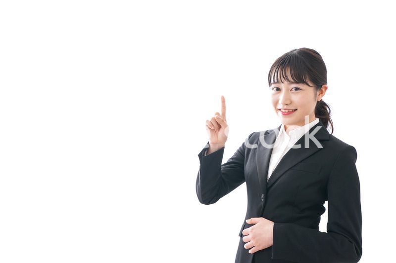 Young business woman pointing something with smile