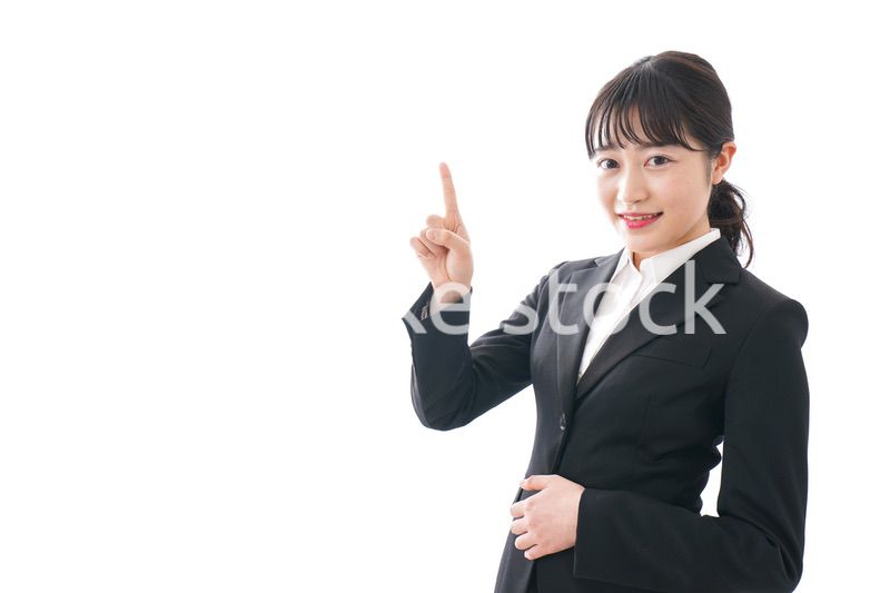 Young business woman pointing something with smile