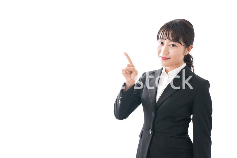 Young business woman pointing something with smile