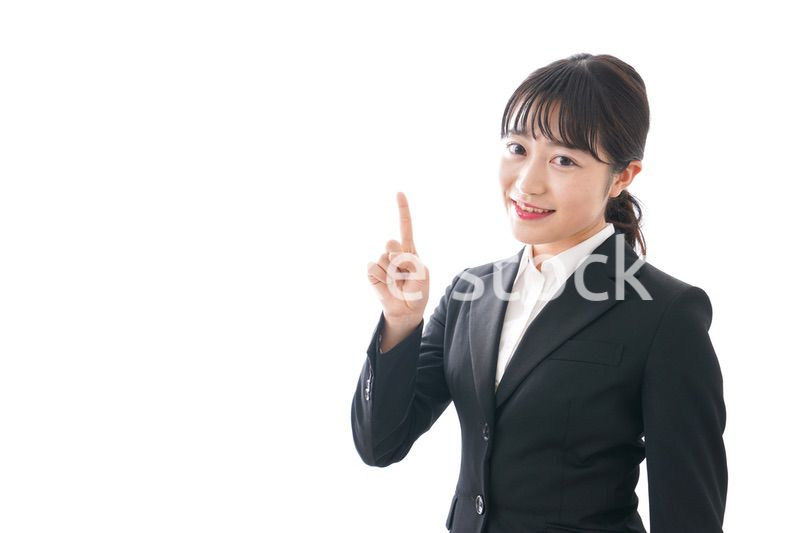 Young business woman pointing something with smile