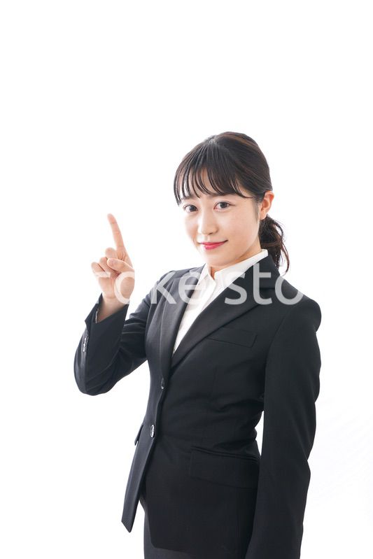 Young business woman pointing something with smile