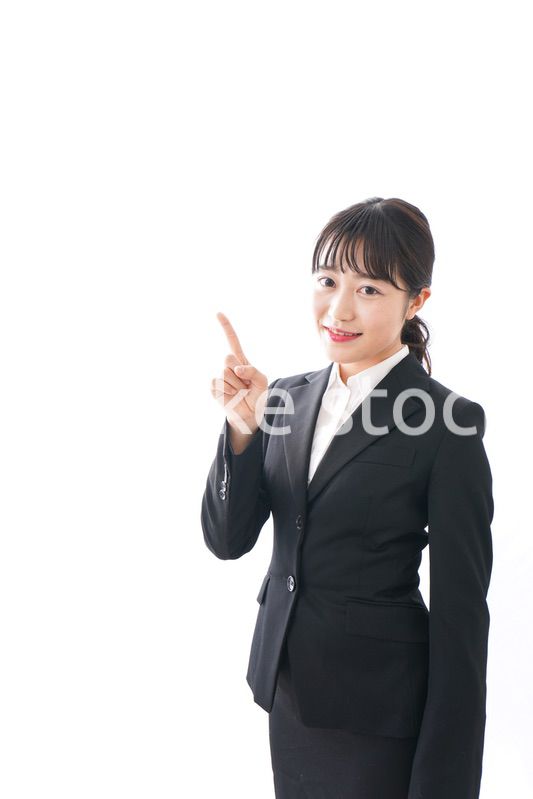 Young business woman pointing something with smile