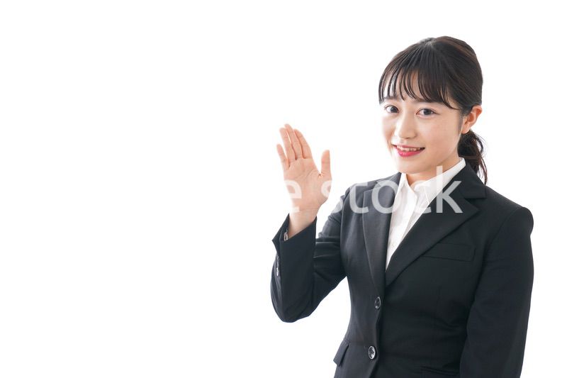 Young business woman pointing something with smile