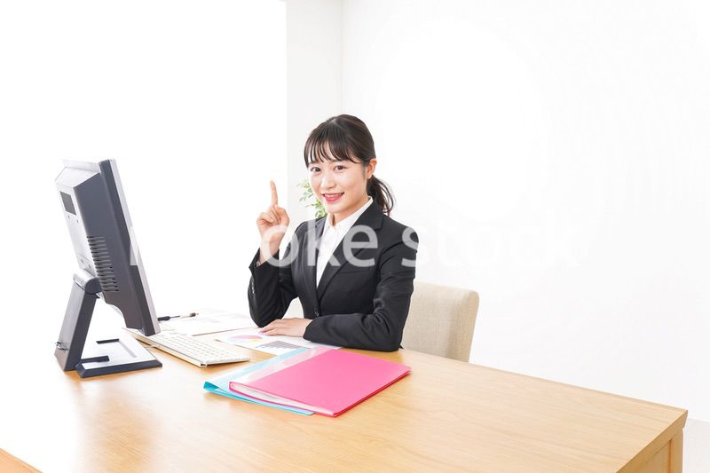 Young business woman pointing something with smile