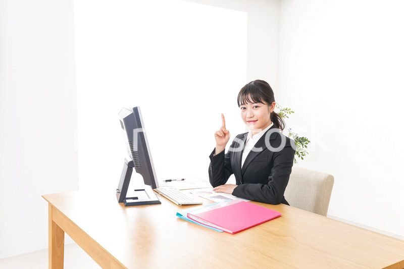 Young business woman pointing something with smile
