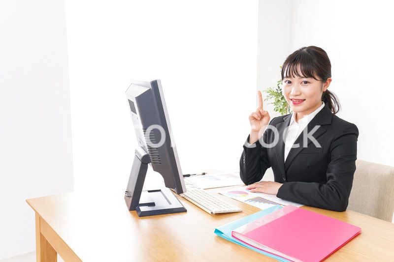 Young business woman pointing something with smile