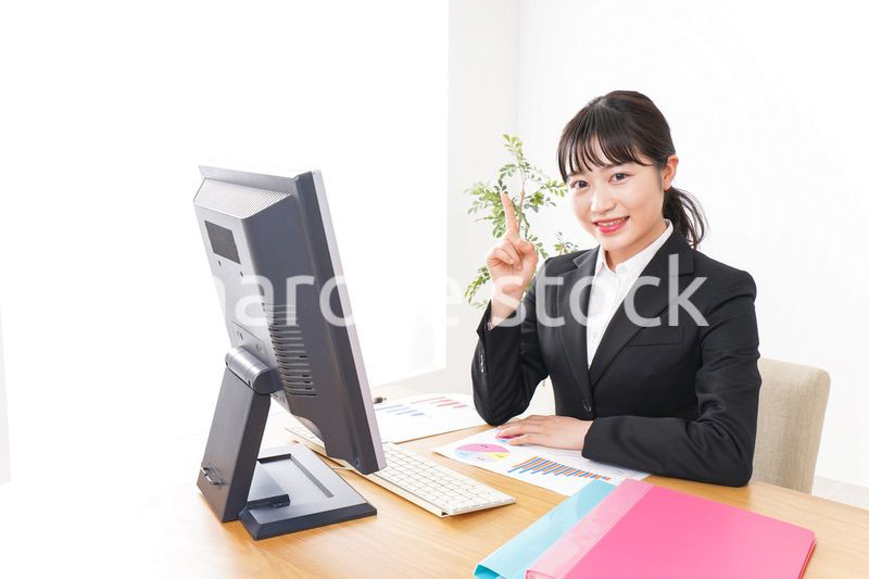 Young business woman pointing something with smile