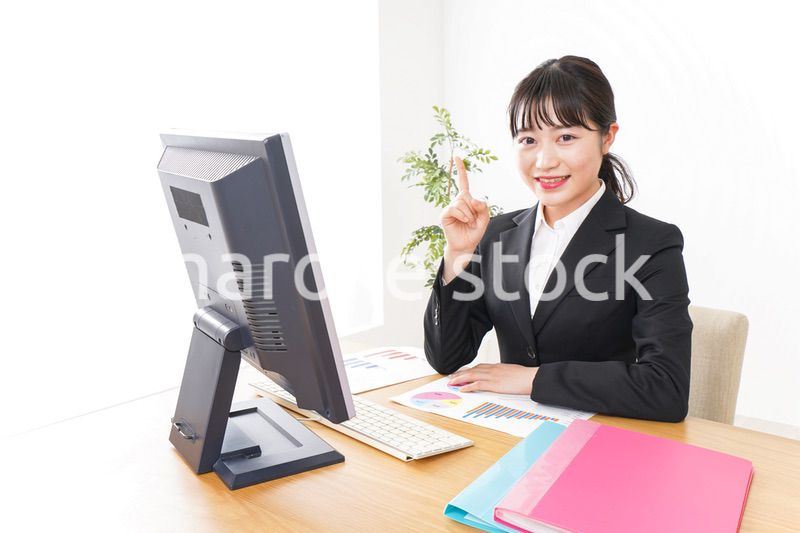 Young business woman pointing something with smile