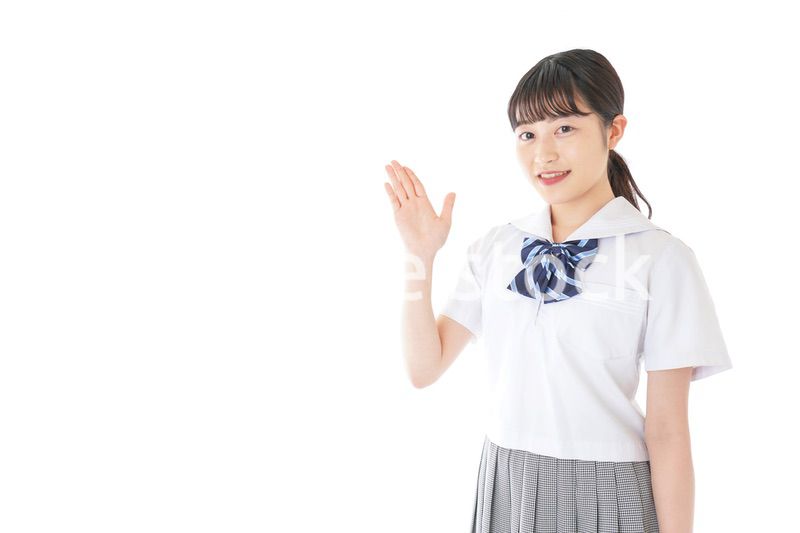 案内をする笑顔の女子学生