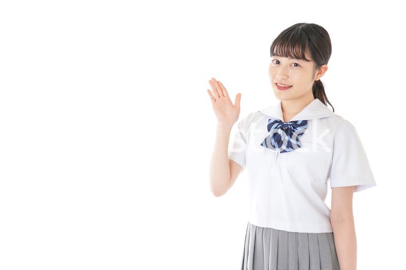 案内をする笑顔の女子学生