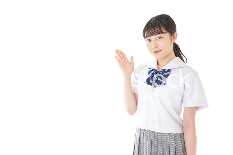 案内をする笑顔の女子学生