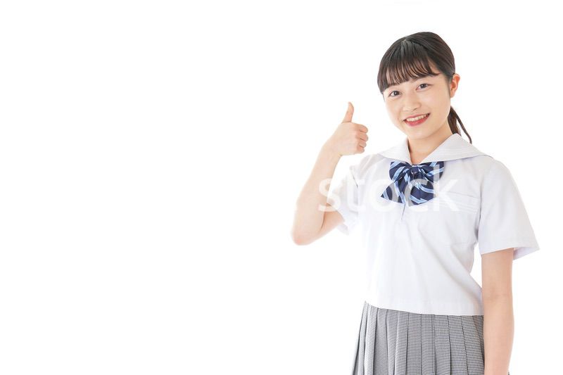 グッドサインをする笑顔の女子学生