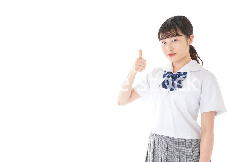 グッドサインをする笑顔の女子学生