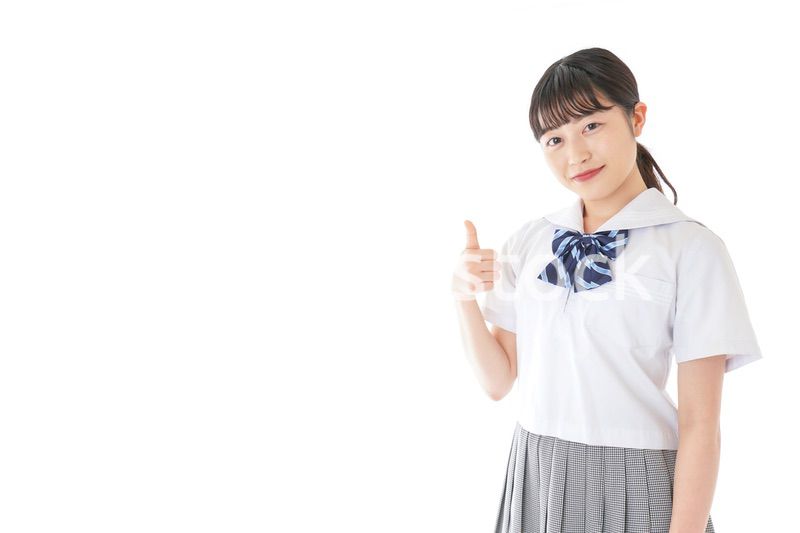 グッドサインをする笑顔の女子学生