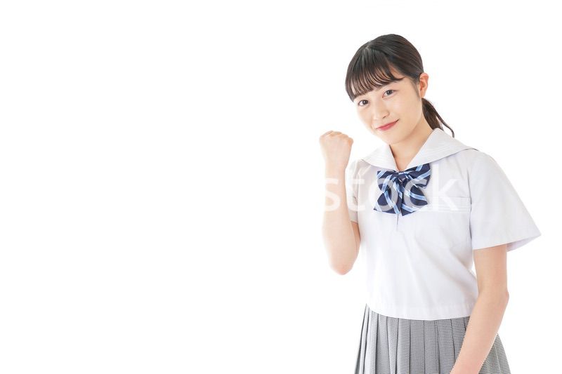 ガッツポーズをする笑顔の女子学生