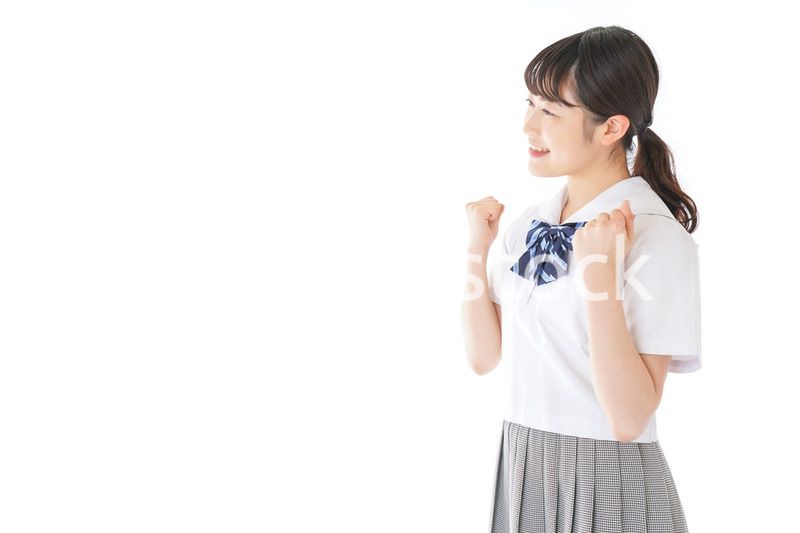 ガッツポーズをする笑顔の女子学生