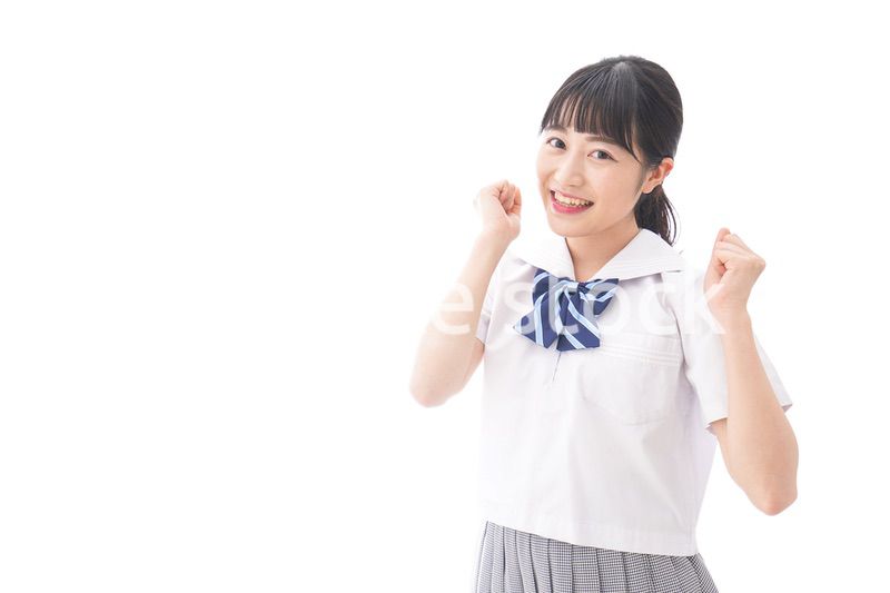 喜ぶ制服姿の学生