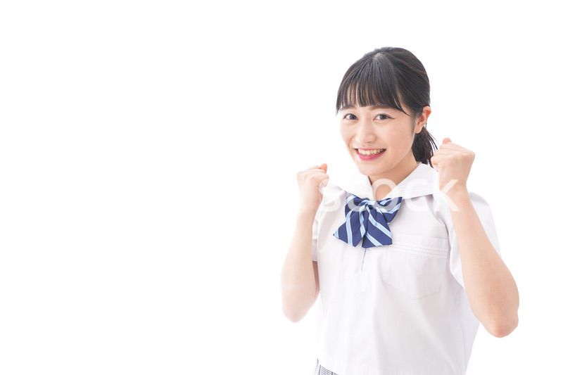 喜ぶ制服姿の学生