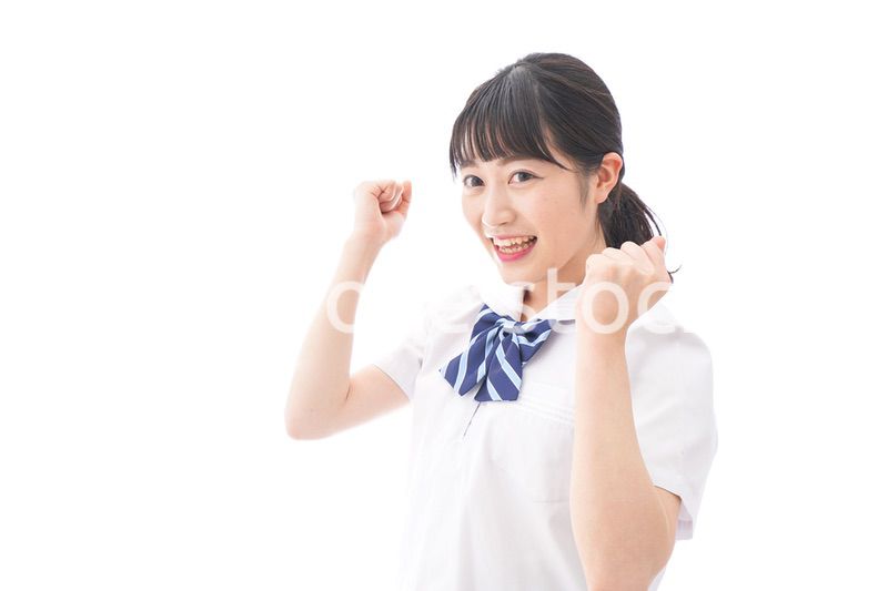 喜ぶ制服姿の学生