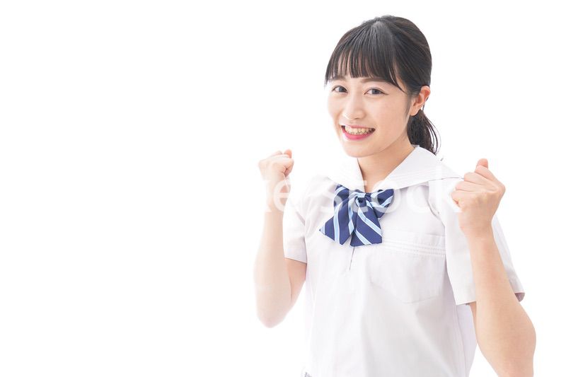喜ぶ制服姿の学生