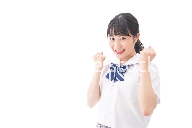 喜ぶ制服姿の学生