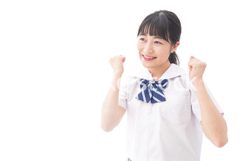 喜ぶ制服姿の学生