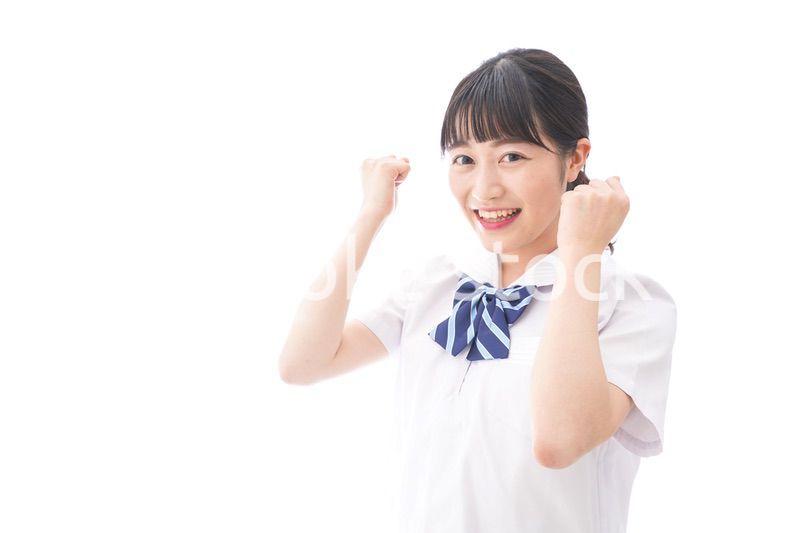 喜ぶ制服姿の学生