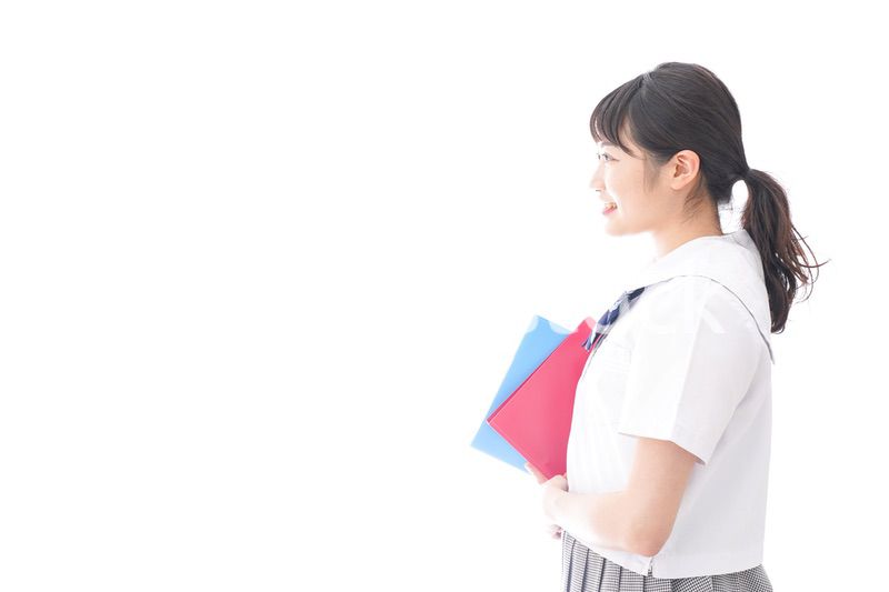 テキストを持つ学生