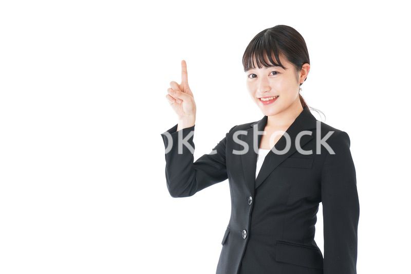 ポイントを示すスーツを着たビジネスウーマン
