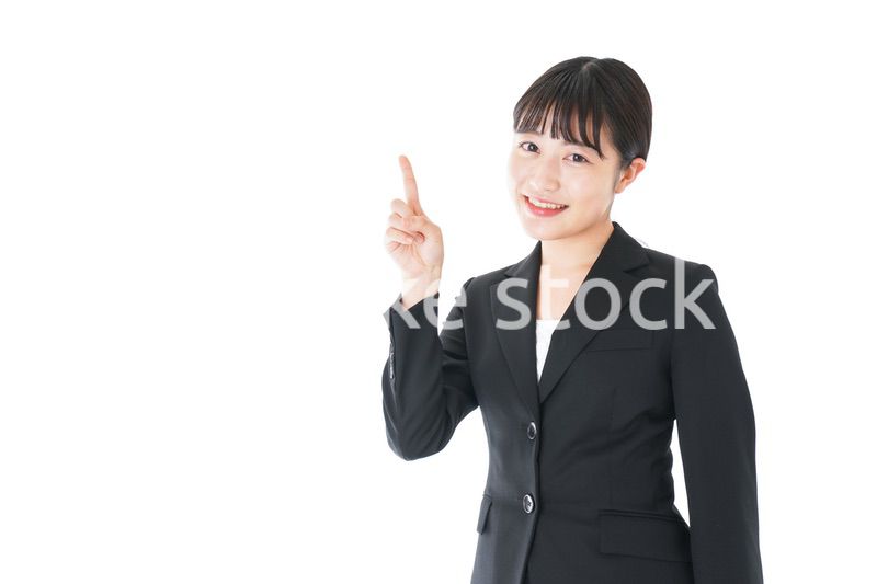 ポイントを示すスーツを着たビジネスウーマン