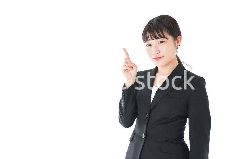 ポイントを示すスーツを着たビジネスウーマン