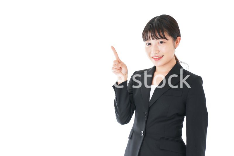 ポイントを示すスーツを着たビジネスウーマン