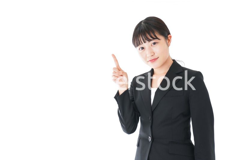 ポイントを示すスーツを着たビジネスウーマン