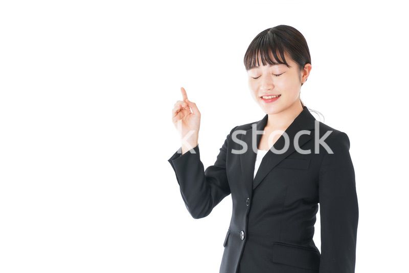 ポイントを示すスーツを着たビジネスウーマン
