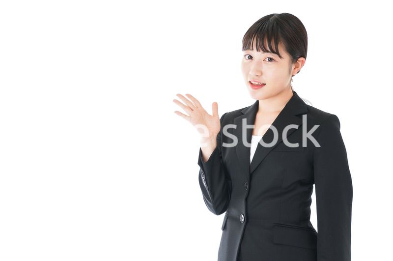 ポイントを示すスーツを着たビジネスウーマン