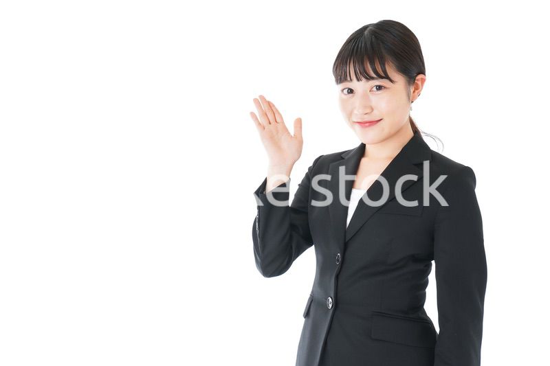 ポイントを示すスーツを着たビジネスウーマン