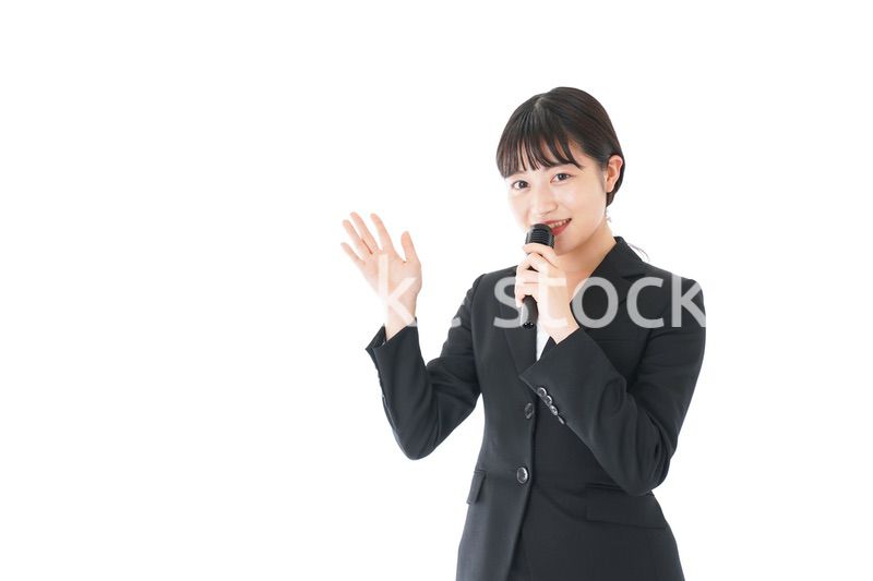 ポイントを示すスーツを着たビジネスウーマン