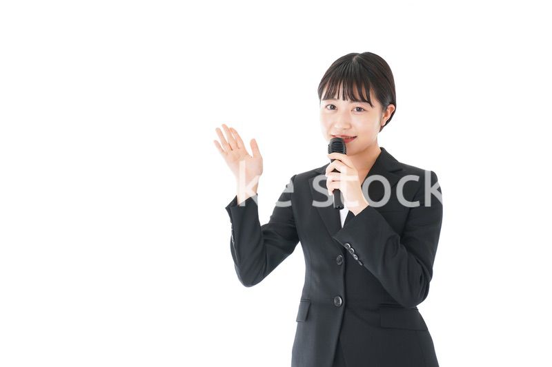 ポイントを示すスーツを着たビジネスウーマン
