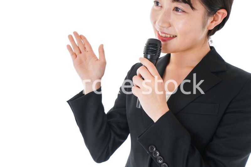 ポイントを示すスーツを着たビジネスウーマン