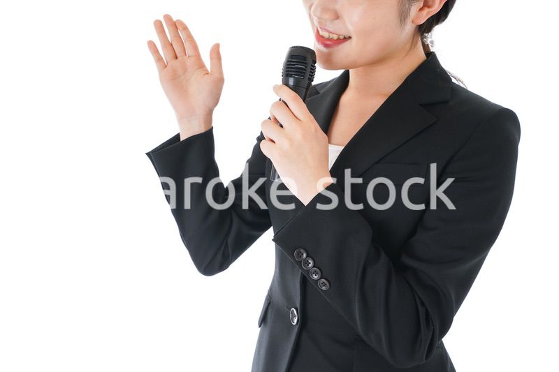 ポイントを示すスーツを着たビジネスウーマン