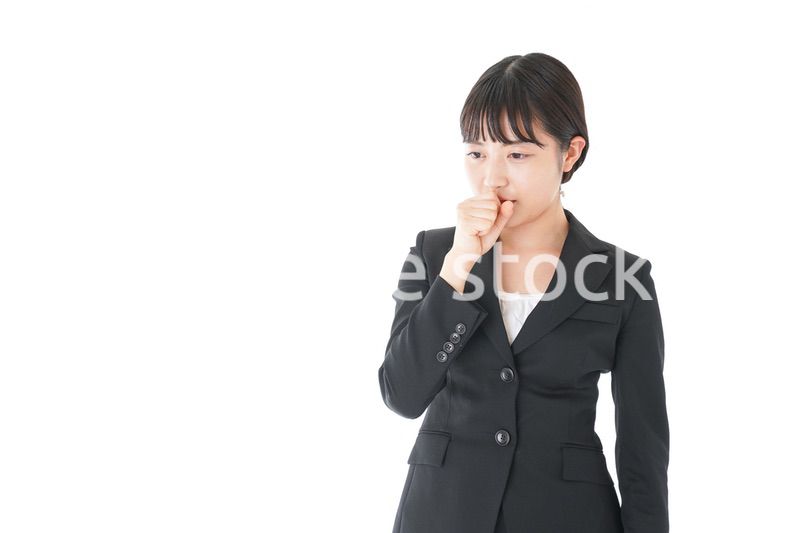 風邪をひいた若いビジネスウーマン