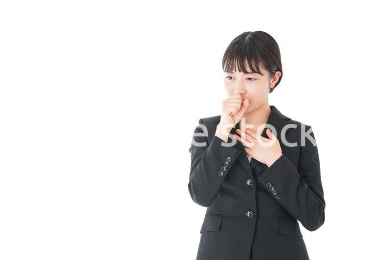風邪をひいた若いビジネスウーマン