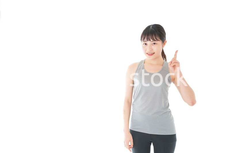 アドバイスをするスポーツウェアを着た若い女性