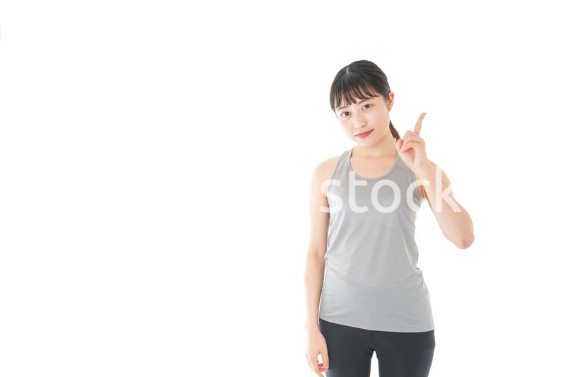 アドバイスをするスポーツウェアを着た若い女性